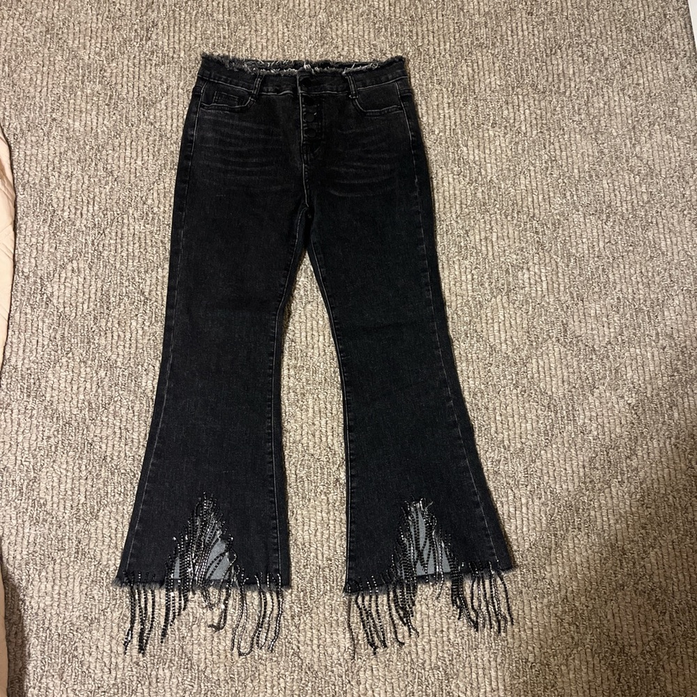 Black distressed jeans with fringe detail